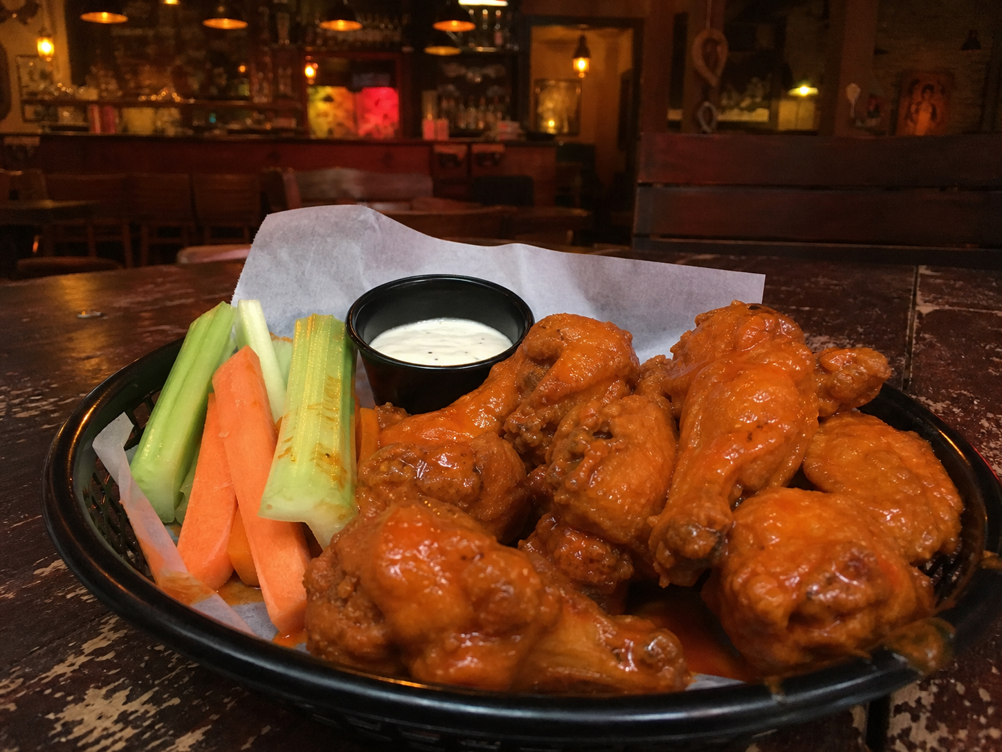 Hot and spicy buffalo wings with veggie sticks and ranch dressing