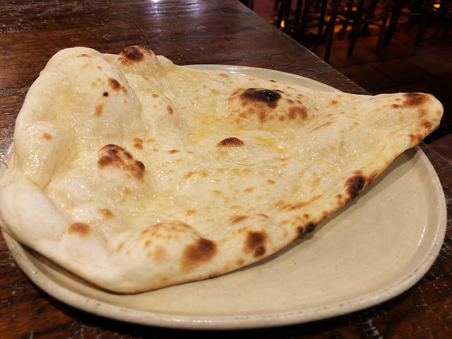Butter naan with melted butter and tandoor marks