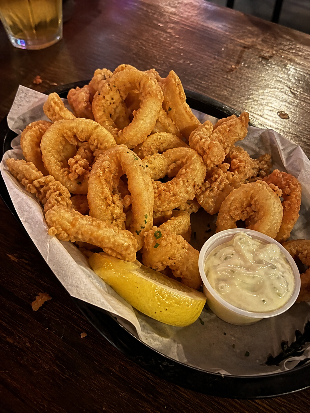 Crispy calamari rings with lemon and dipping sauce