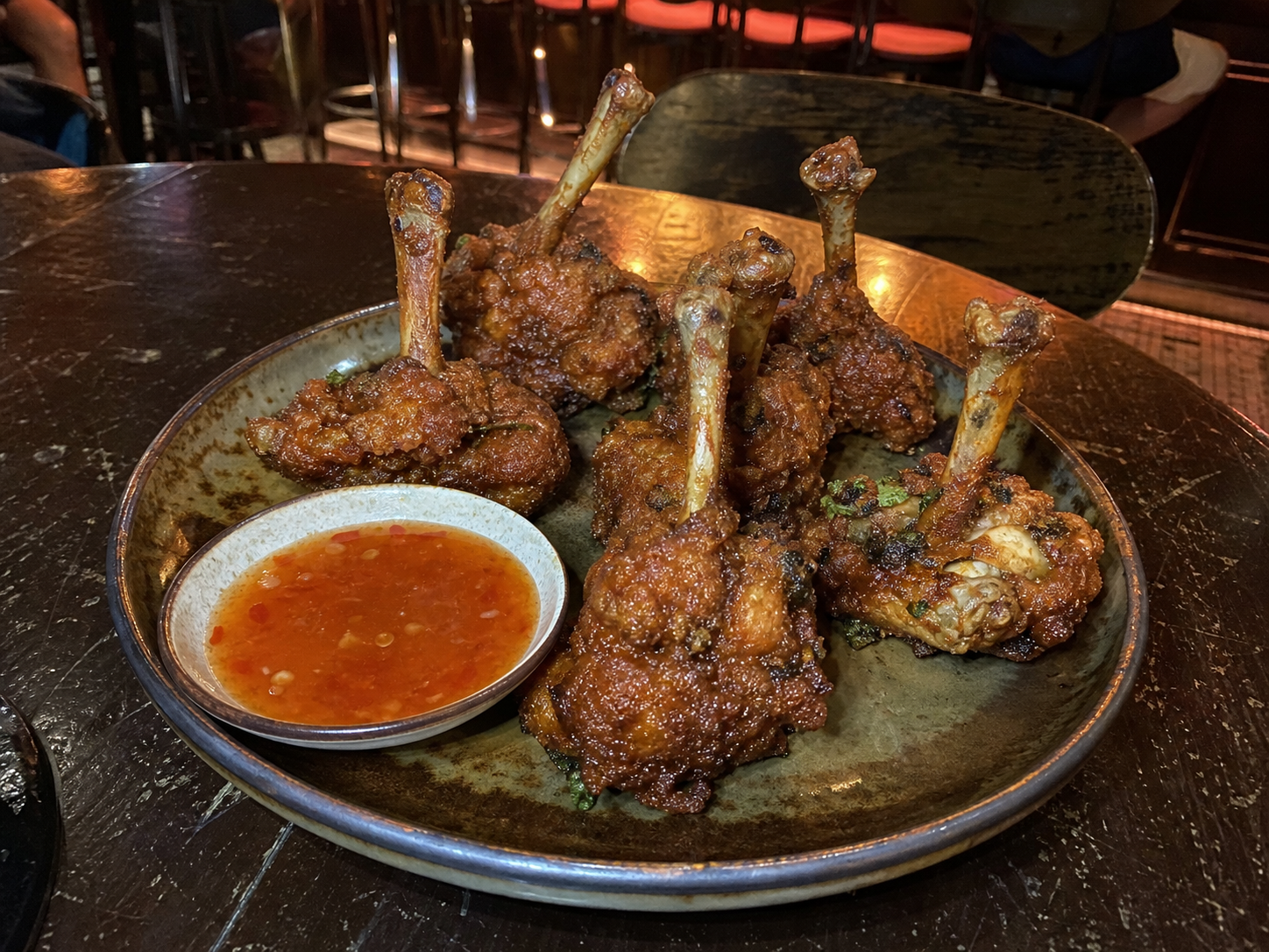 Crispy chicken lollipops with dipping sauce