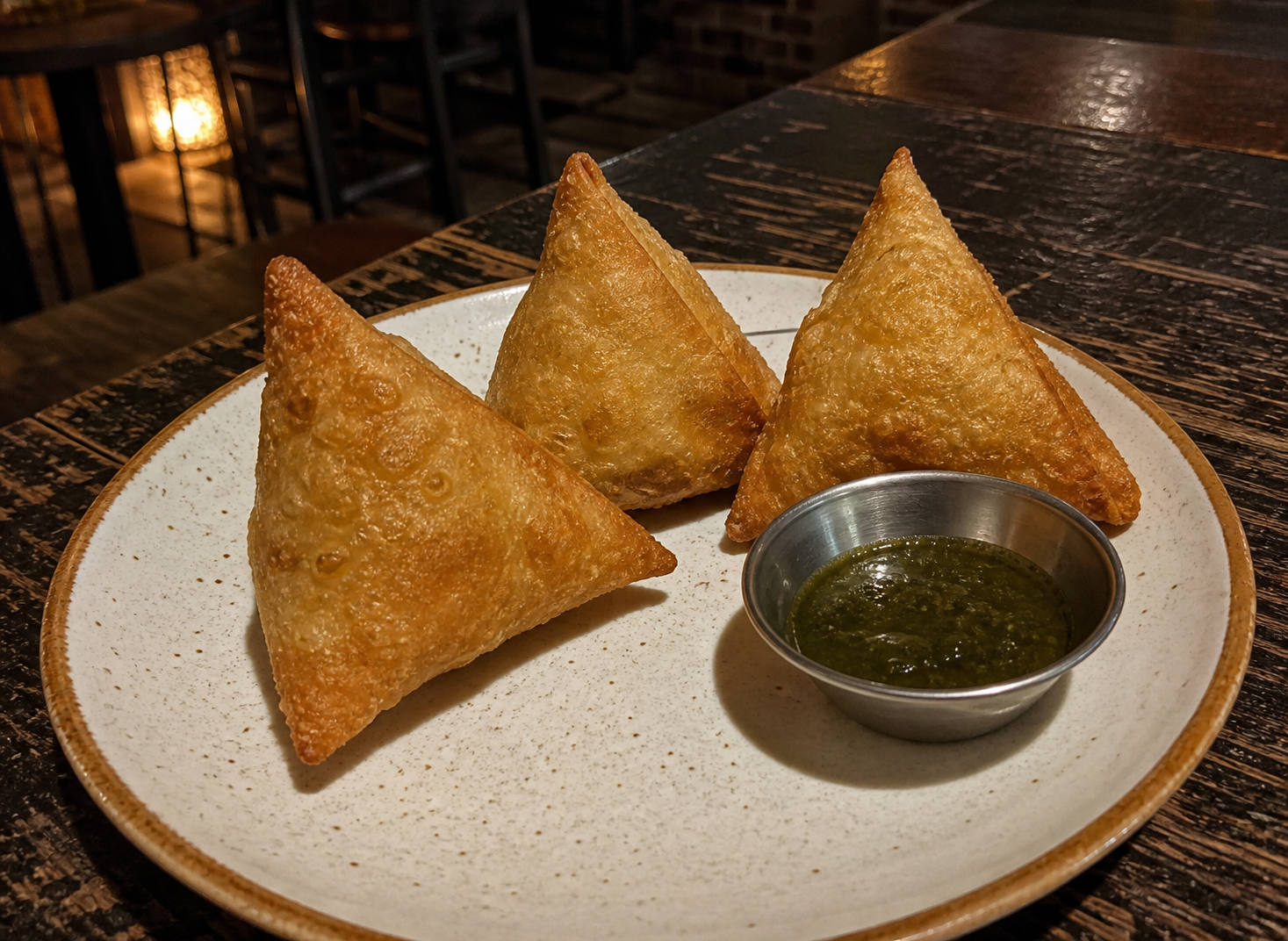 Chicken samosas with green chutney