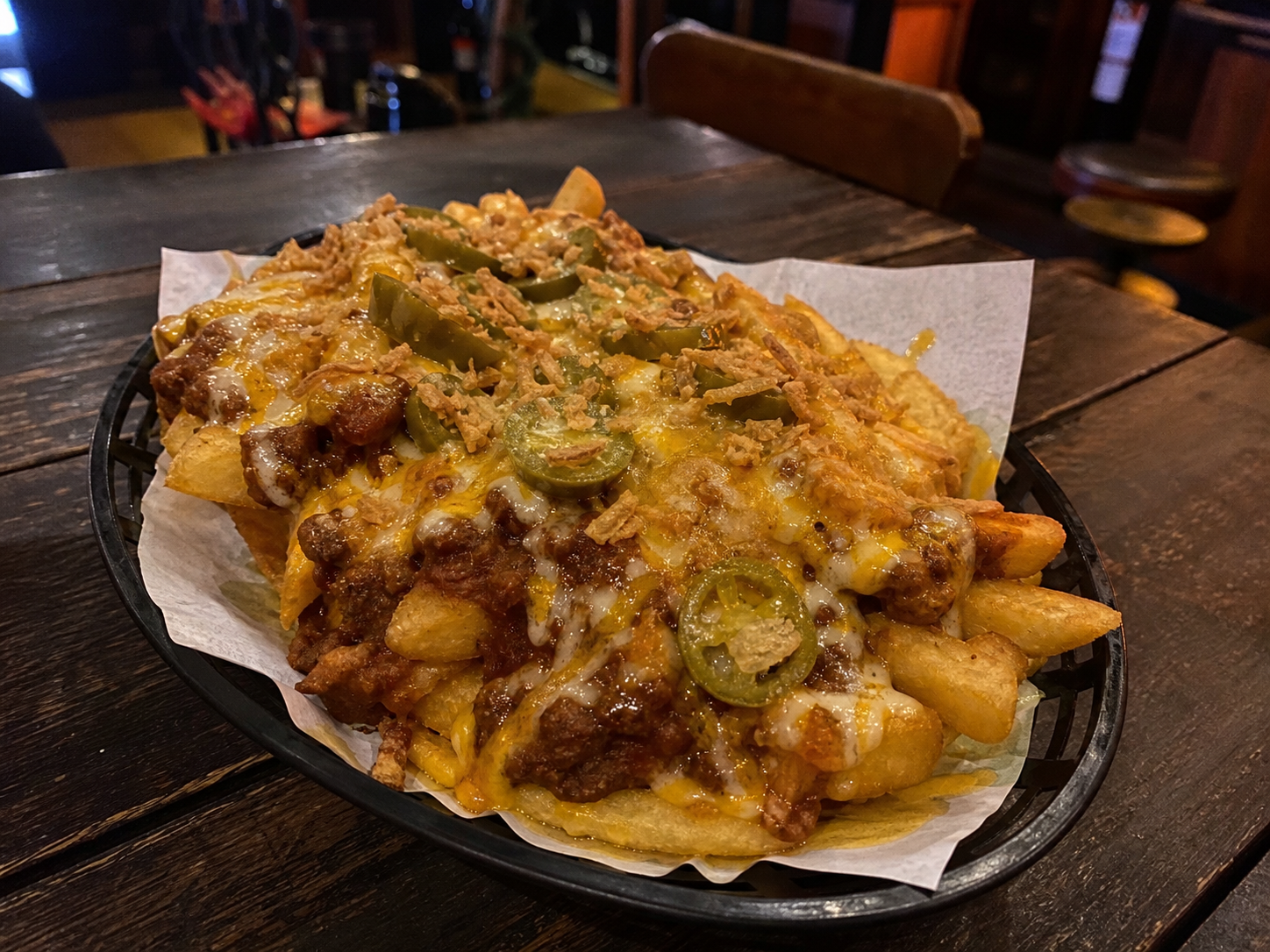 Chili cheese fries with chilli con carne, jalapenos and cheese