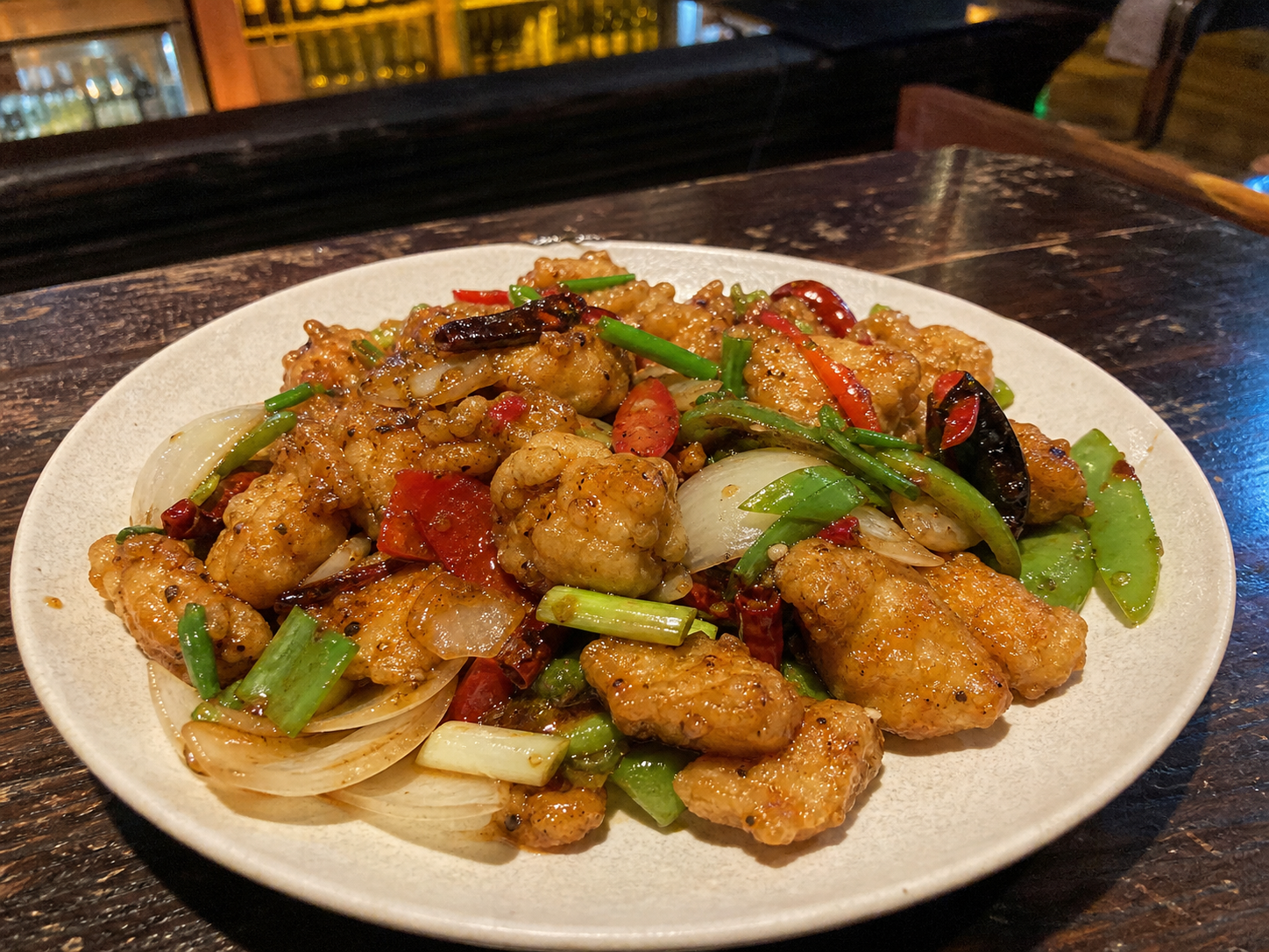 Chilli fish with bell pepper, onion and dried chillies