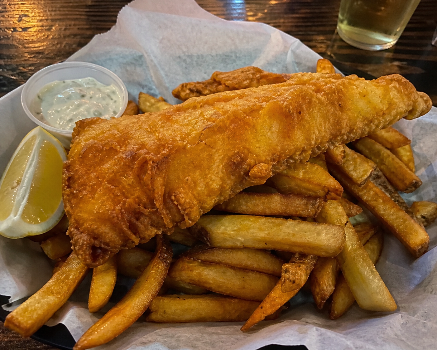 Battered fish and chips with lemon and tartar sauce