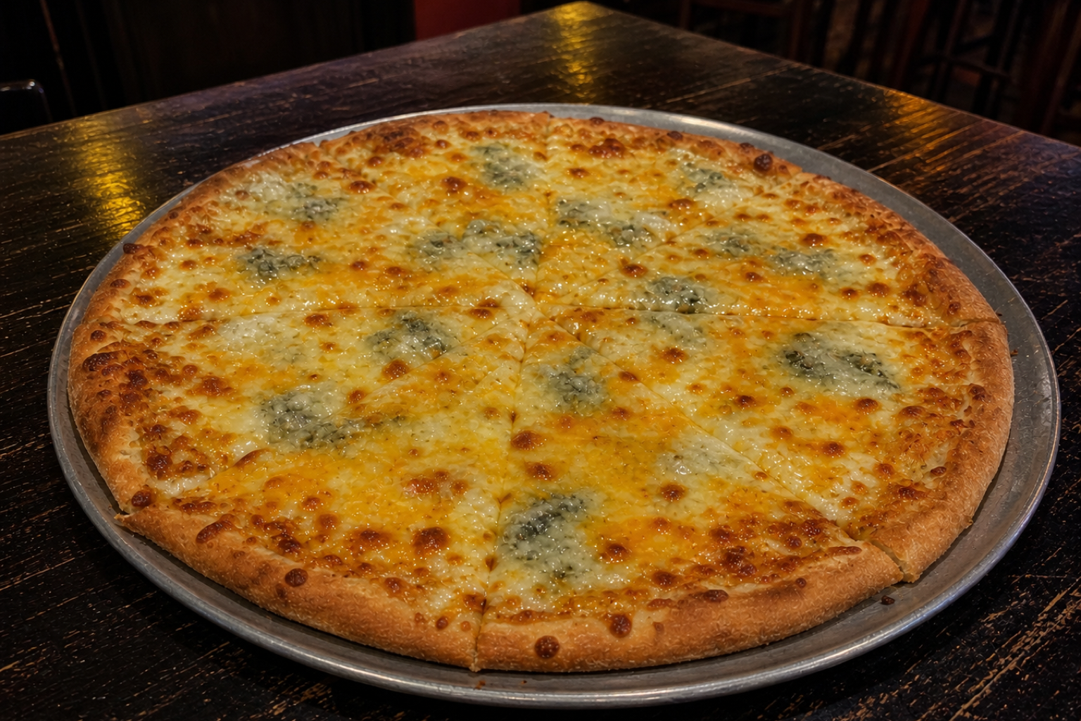 Hand-tossed Four Cheese pizza with mozzarella, gorgonzola, parmesan and cheddar