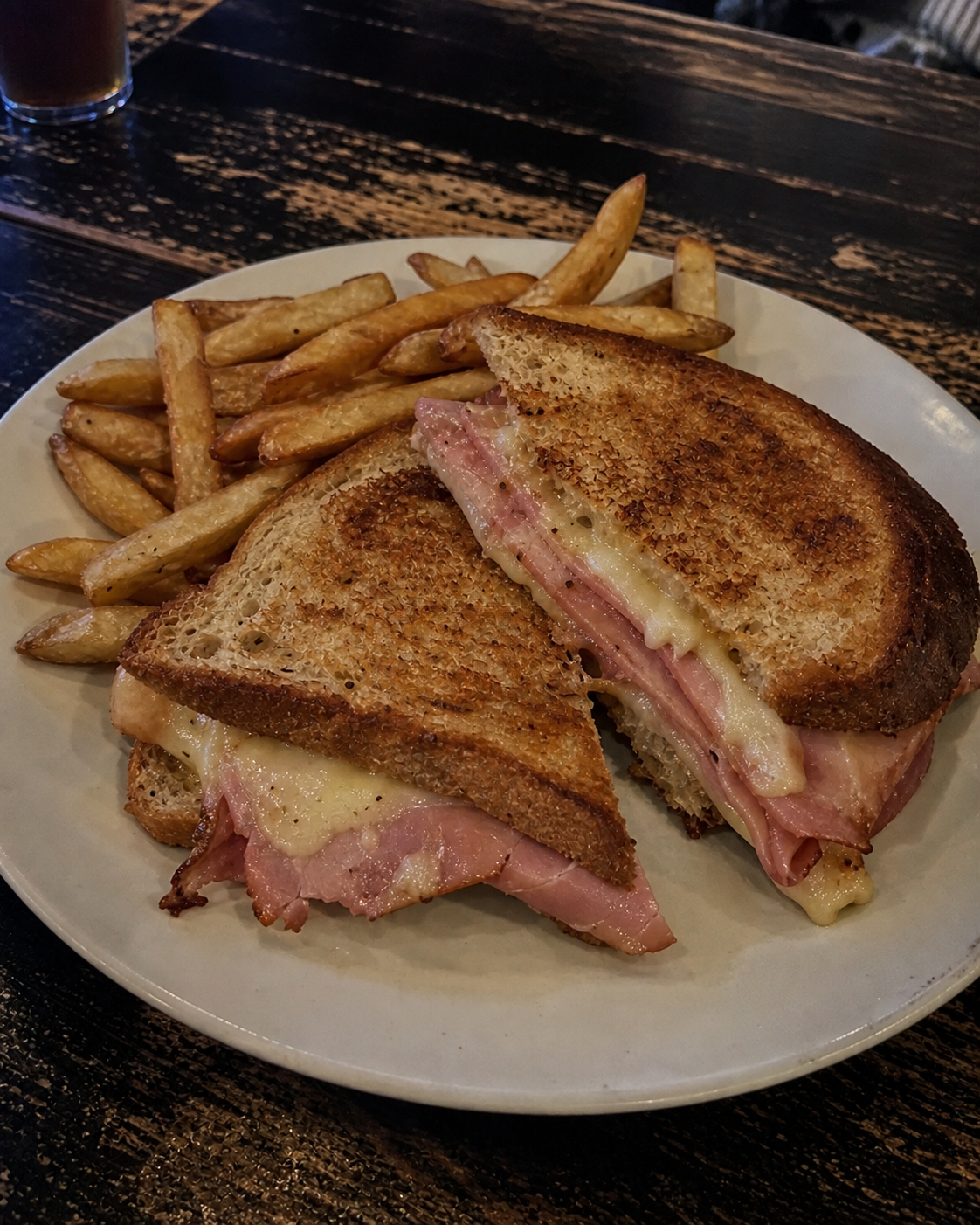Toasted ham and cheese sandwich with fries