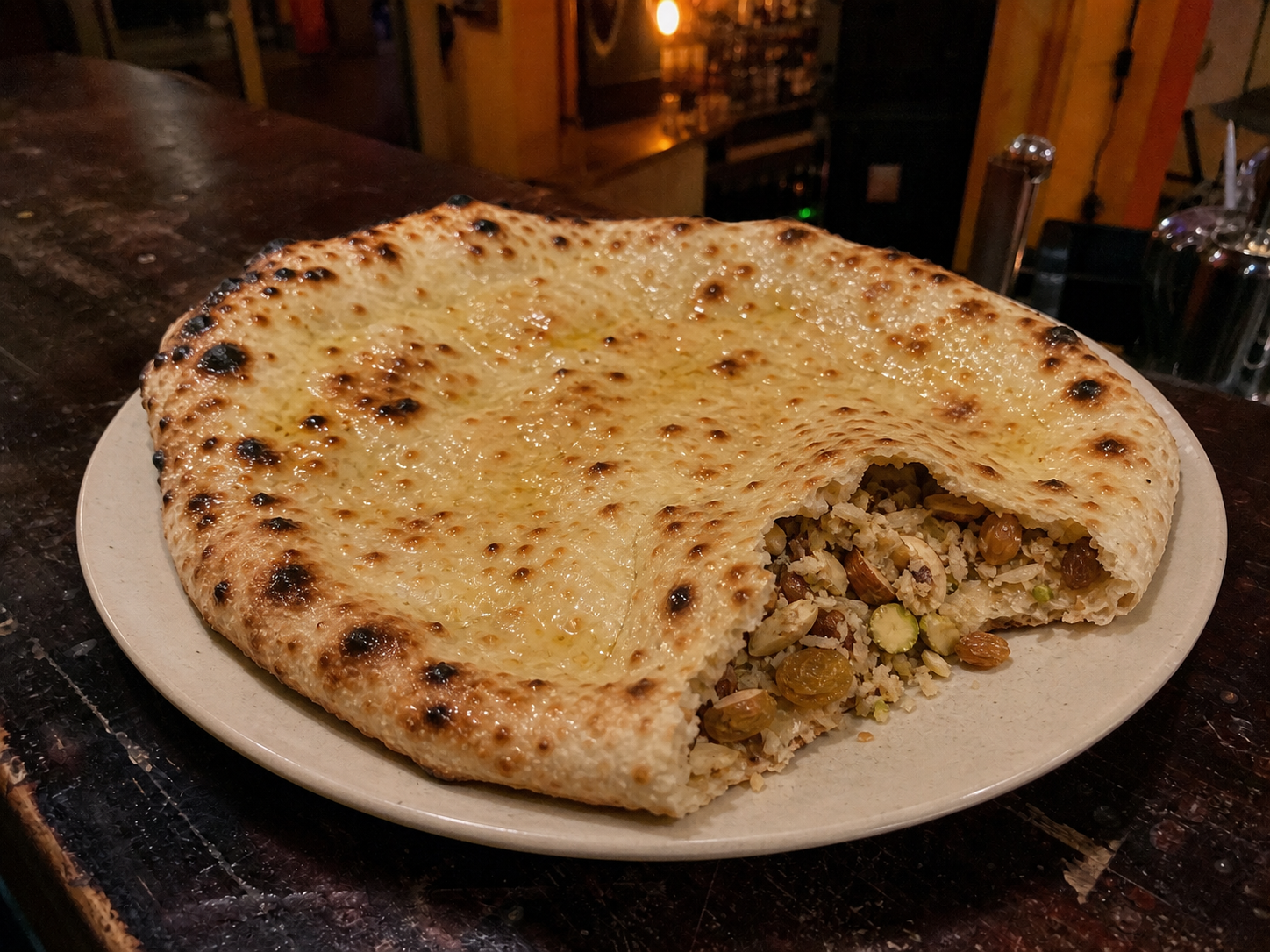 Ghee-brushed Kashmiri naan stuffed with dried fruit, nuts and coconut
