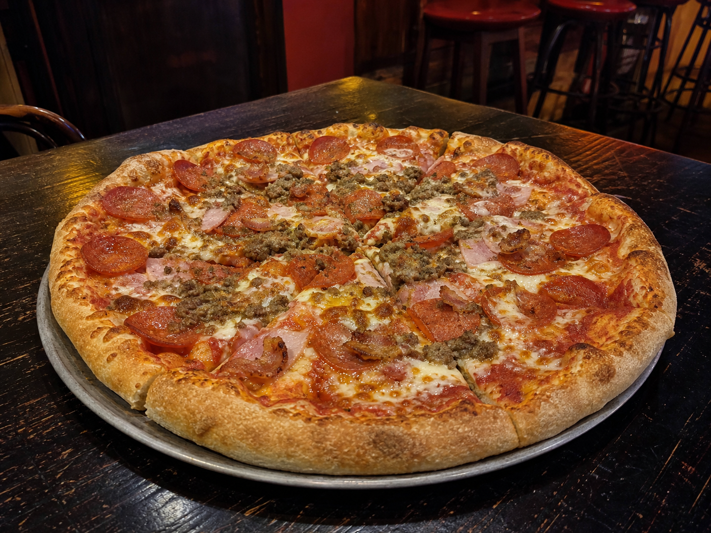 Thick-crust meat lovers pizza with pepperoni, minced beef, ham and bacon