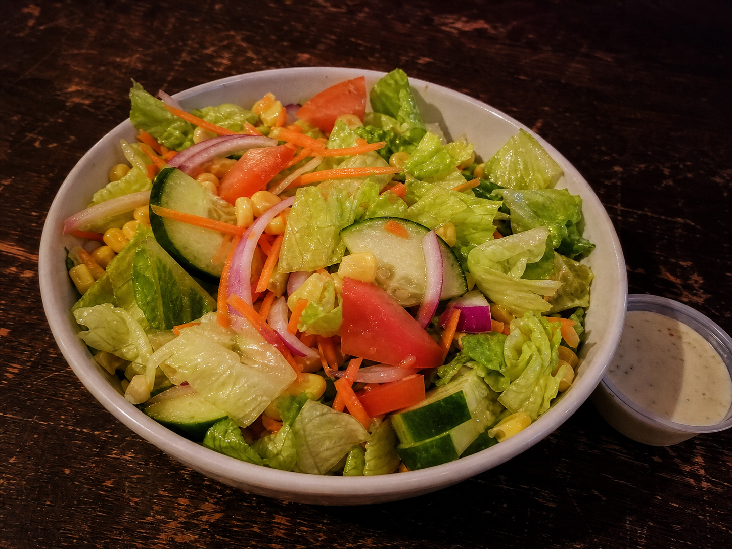 Mixed salad with lettuce, cucumber, tomato, carrot and corn