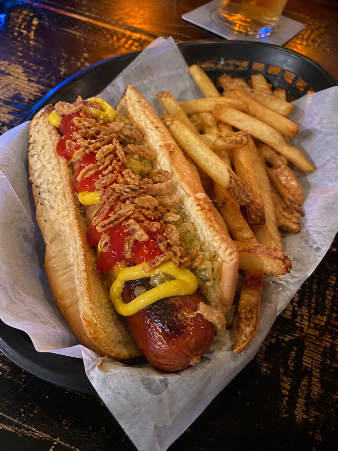 Original pub hot dog with mustard, ketchup, relish, fried onions and fries