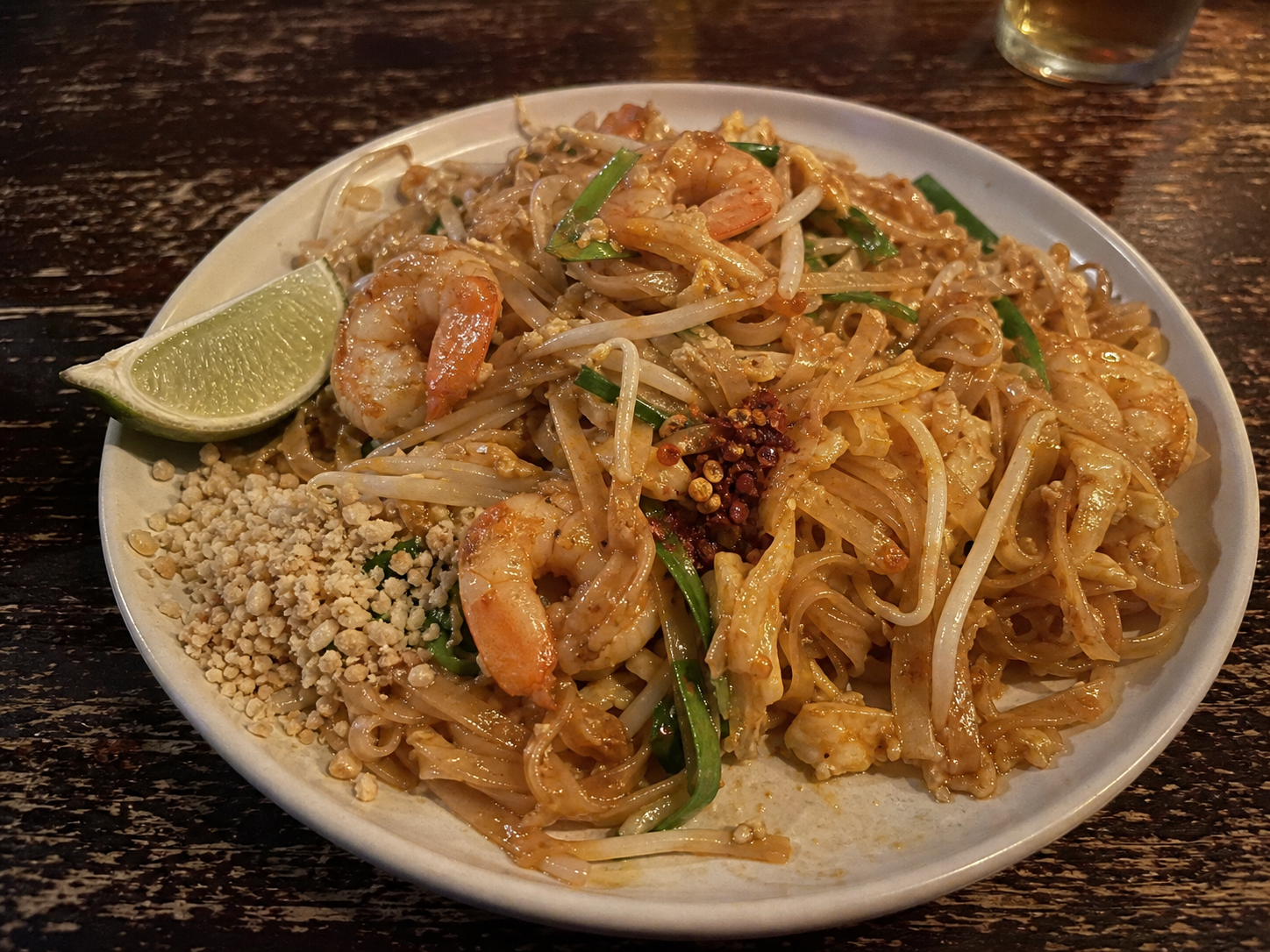 Shrimp Pad Thai with rice noodles, sprouts, peanuts and lime