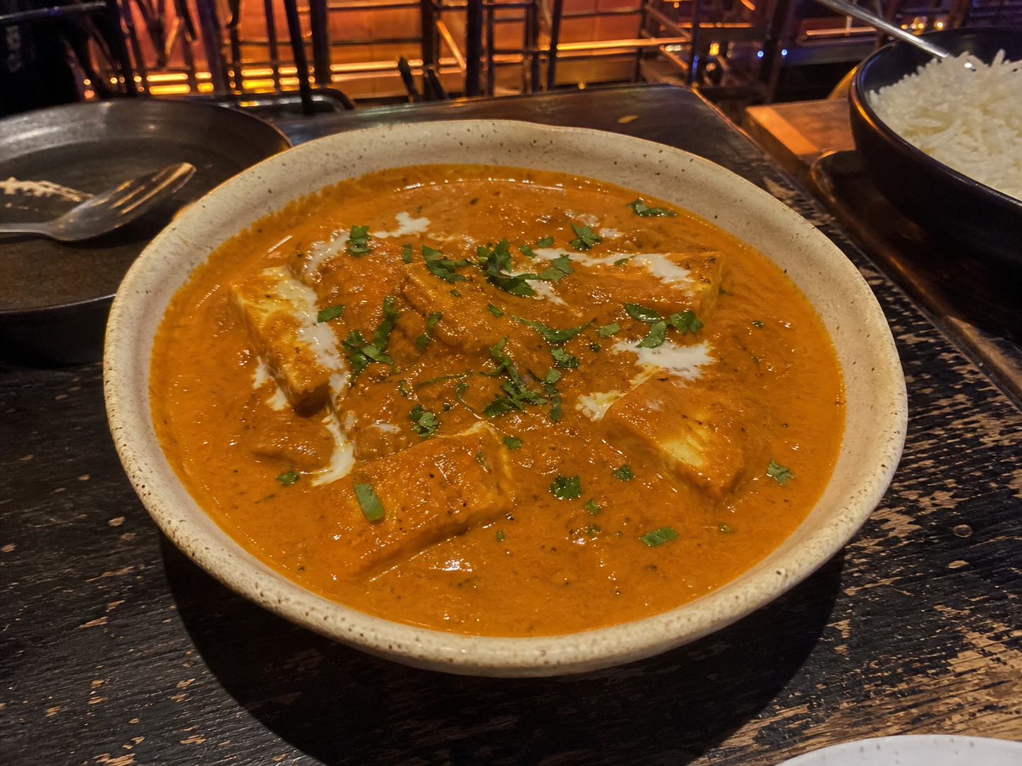 Paneer butter masala in creamy tomato gravy