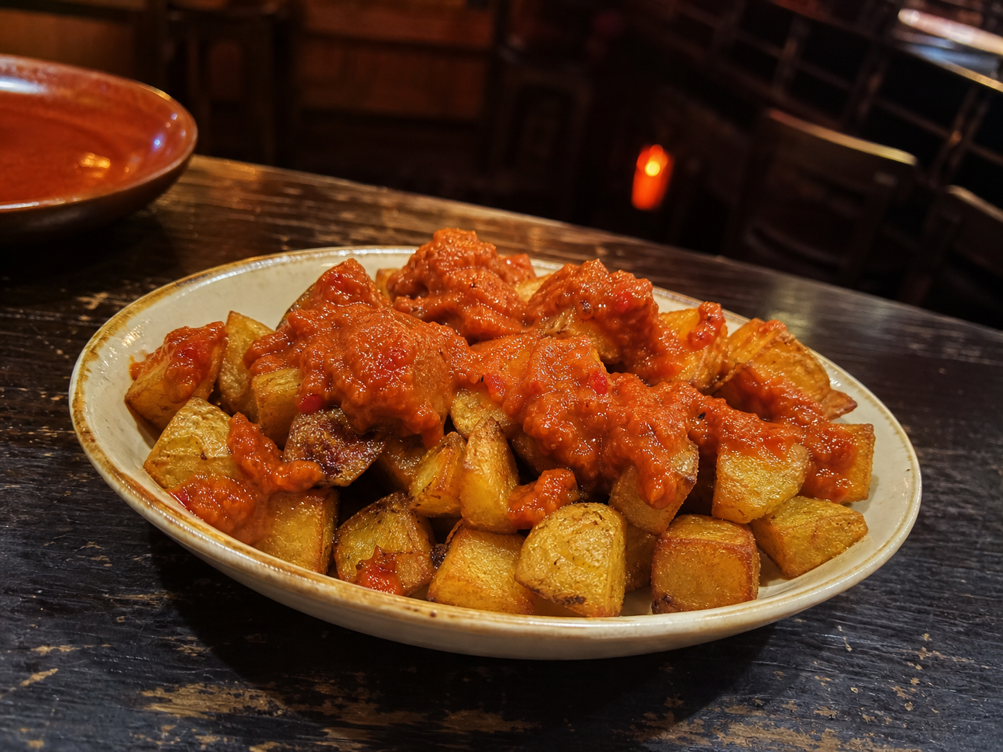 Patatas bravas crispy potato cubes with spicy sauce