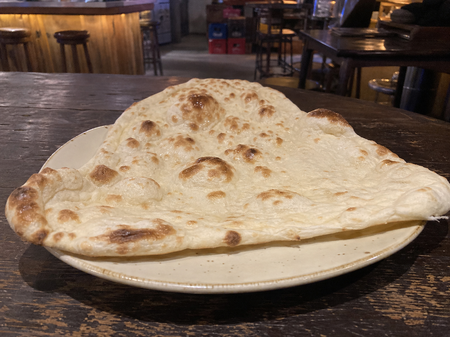 Plain naan with blistered tandoor-baked texture