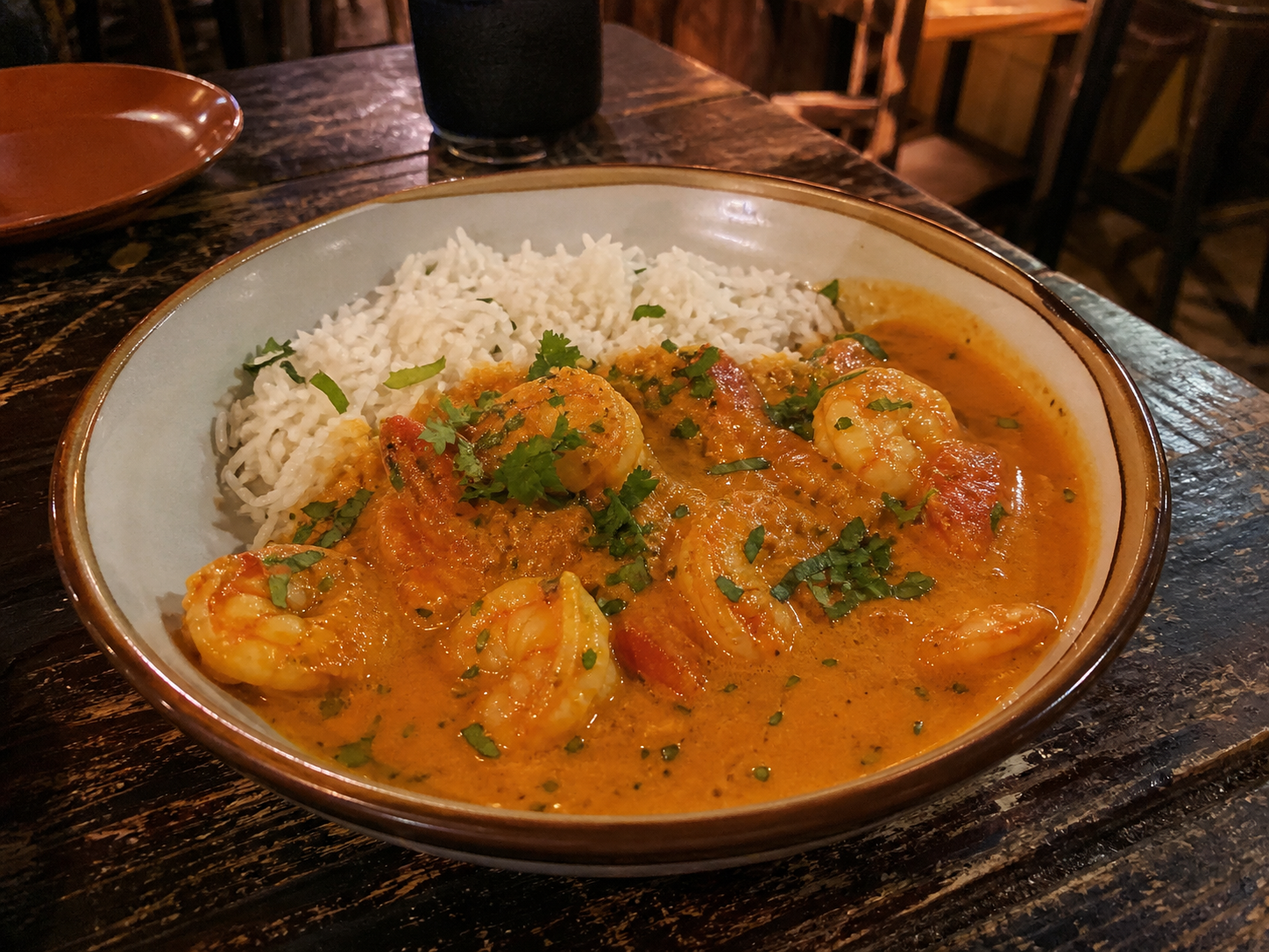 Prawn masala in creamy tomato gravy with rice