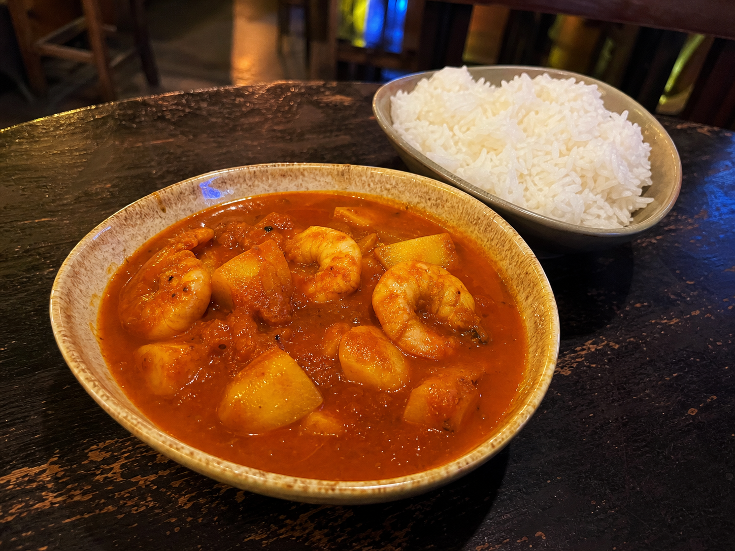 Prawn vindaloo with potato and rice