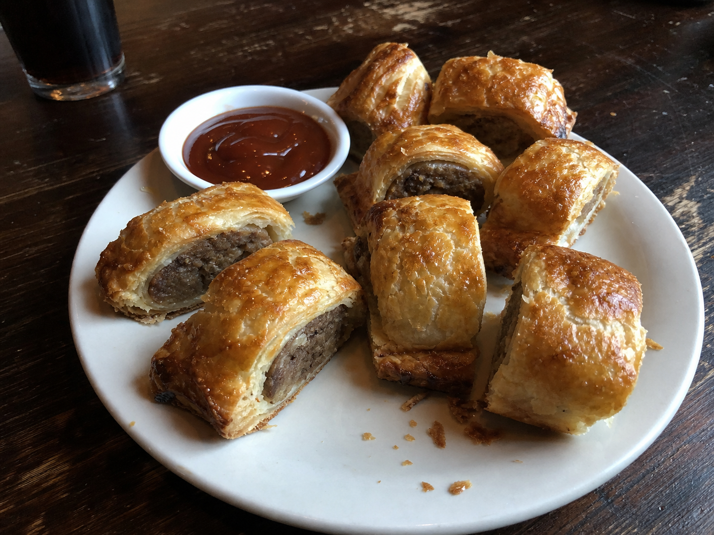 Golden sausage rolls with dipping sauce