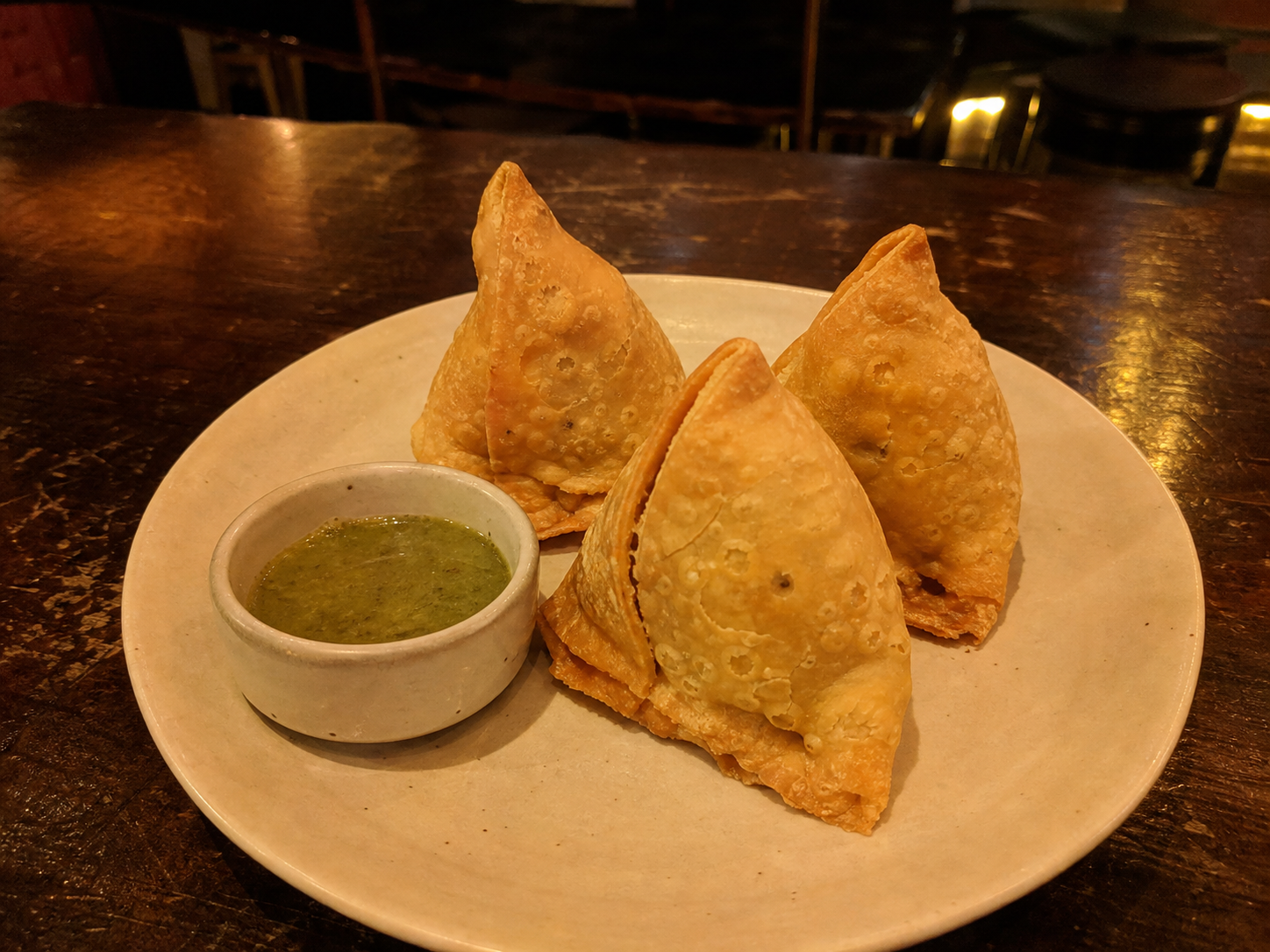 Vegetable samosas with green chutney